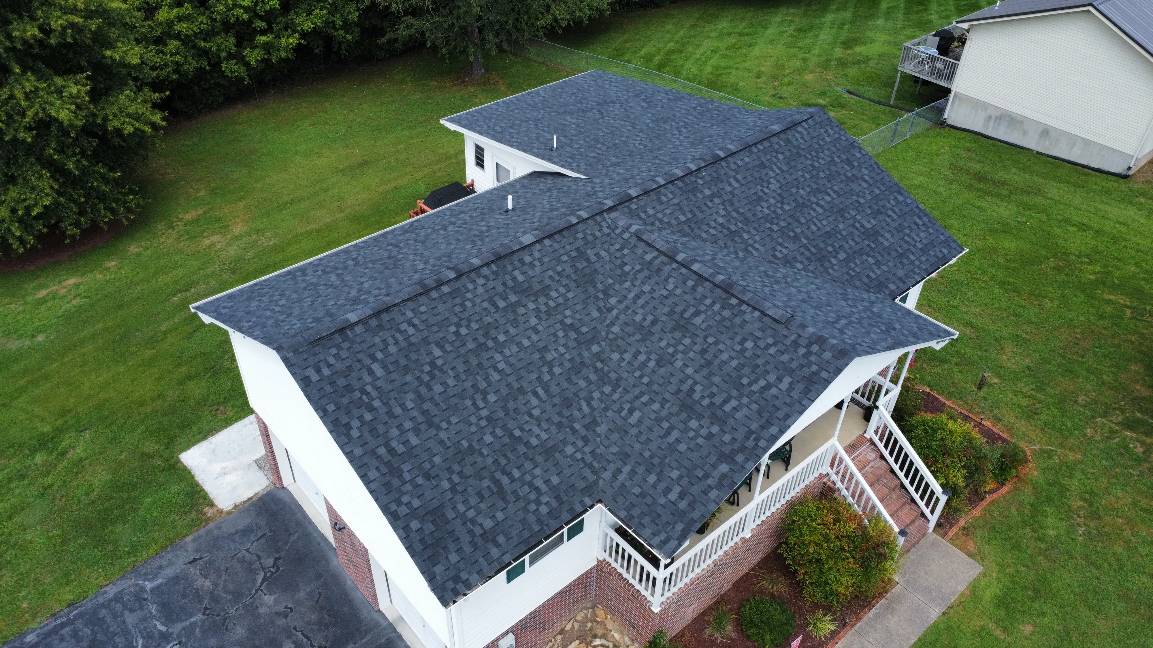 Shingle roof over the front porch of a finished home