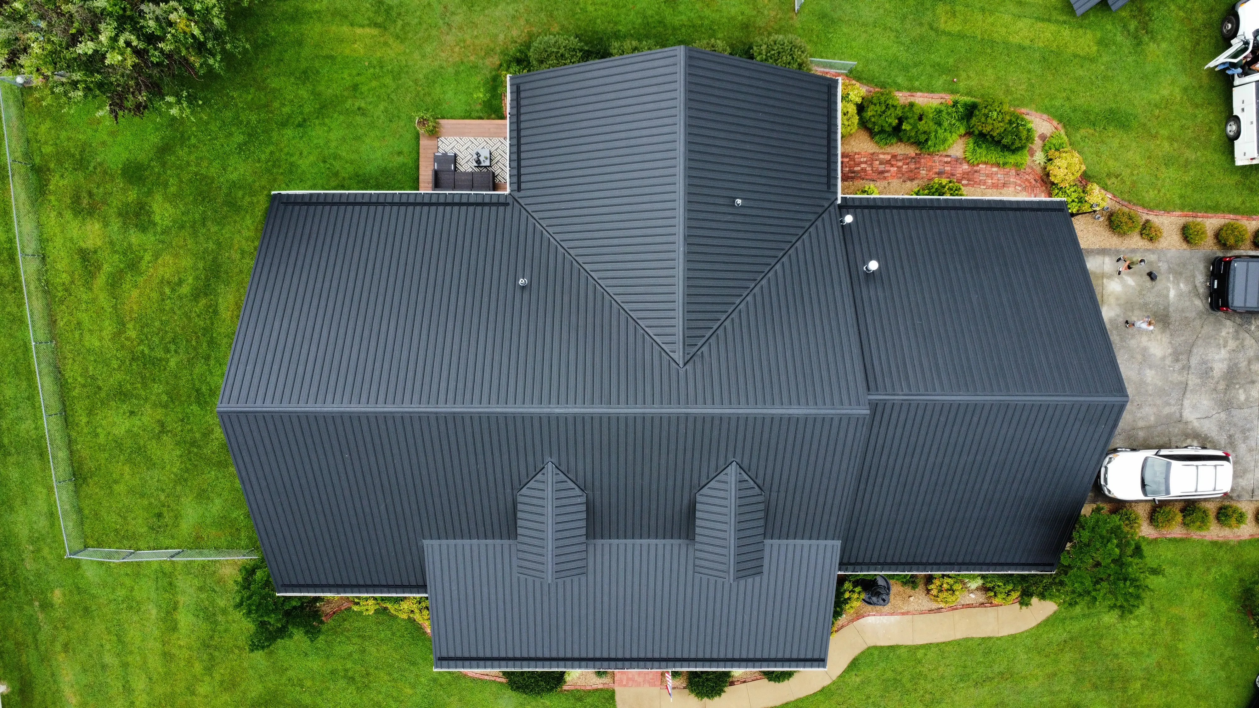 Modern home with a dark standing-seam metal roof