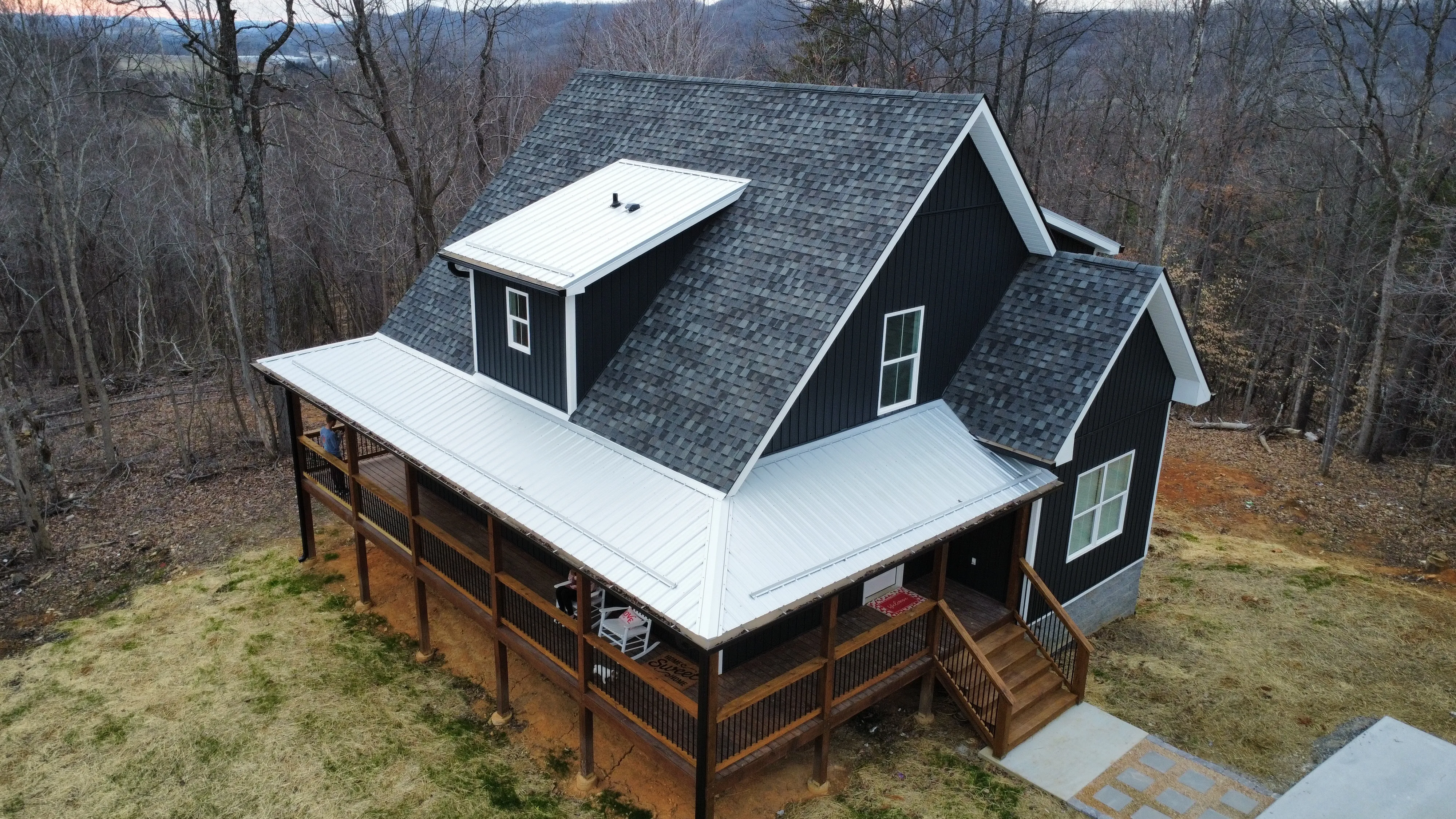 Modern home with a new grey shingle roof, installed by White's Roofing Co